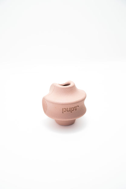 Pink dog treat toy with 'Pupr' branding on a white background